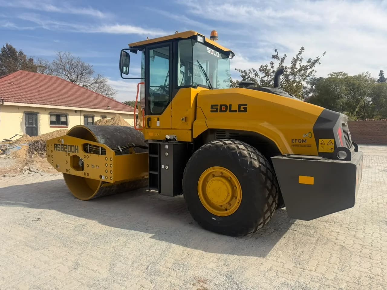 Road roller compacting on site